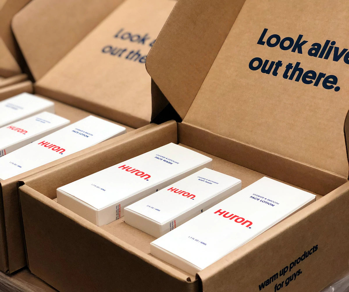 Shipping boxes are lined up, ready to close up and mail to customers.