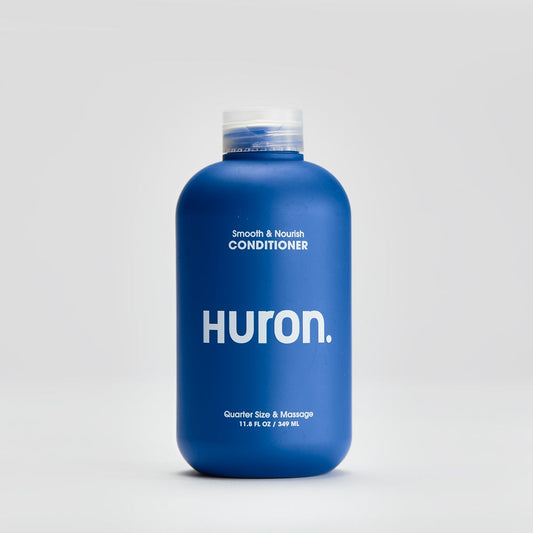 Conditioner for Men blue bottle against grey background